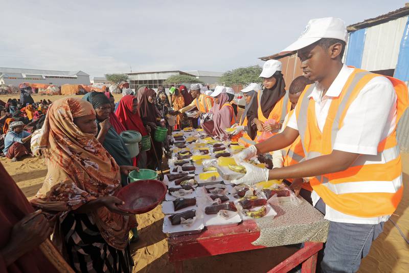Local NGO prepares Iftar food for people at an internally-displaced camp on the outskirts of Mogadishu, Somalia. AP Photo