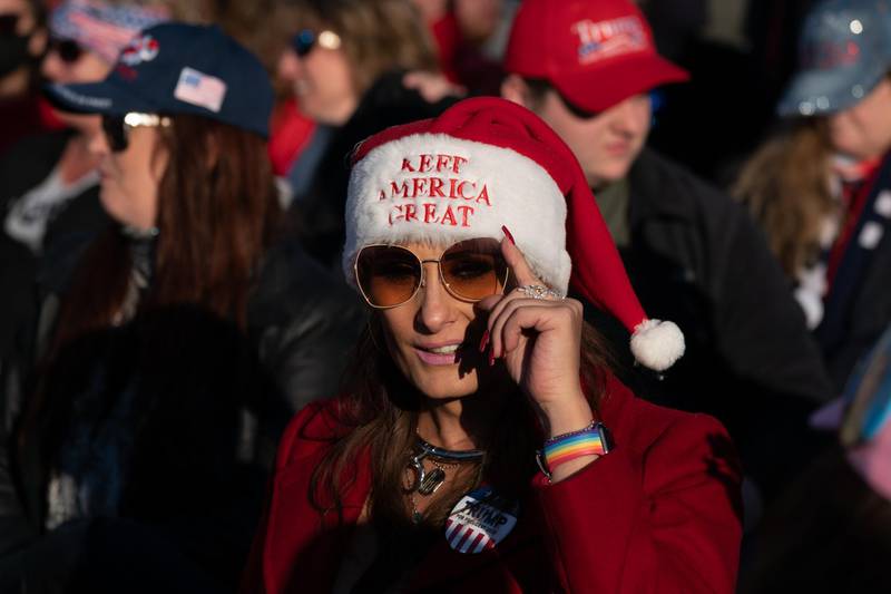 An attendee wears a santa hat that reads 'Keep America Great' during a rally with U.S. President Donald Trump in Valdosta, Georgia, U.S. Bloomberg