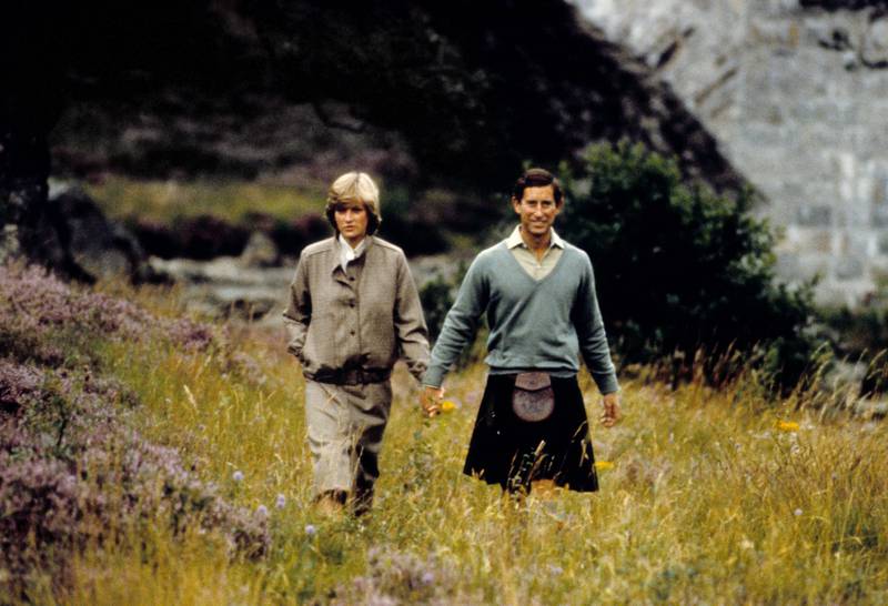 Princess Diana and Prince Charles hold hands  on their honeymoon at Balmoral in Scotland, in August 1981