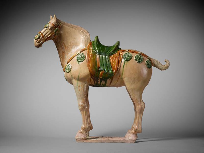 Bactrian Horse, Tang Dynasty, China, 700-800: The development of the “Silk Roads” – terrestrial links between Asia and Europe – led to a centuries-long trading of ideas and artistic techniques across continents. One of the earliest beneficiaries of this was the Chinese empire of the Tang dynasty (618-907), which imported many exotic products, including glass, ivory and pearl, from Central Asia. The influence of this can be seen in the funerary figurines – or mingqi – which accompanied the dead when they were buried.