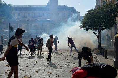 Anti-government protesters clash with Lebanese riot police during a protest outsid Lebanese Parliament. EPA