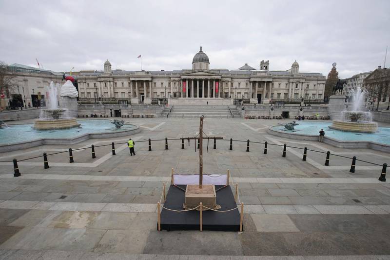 A crucifix is placed in London's Trafalgar Square to mark Good Friday on April 2, 2021. PA via AP)