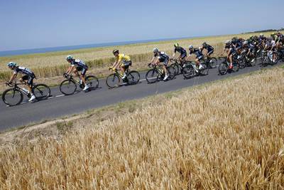 The pack with Tony Martin, wearing the overall leader’s yellow jersey, rides along the English Channel on France’s Normandy west coast during the sixth stage of the Tour de France. Laurent Cipriani / AFP / July 9, 2015