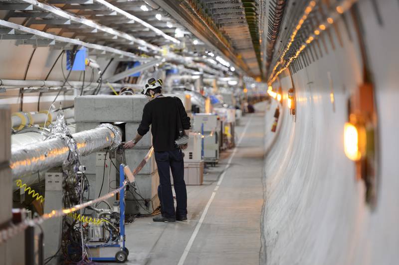 A technician works in the Large Hadron Collider at CERN. AP