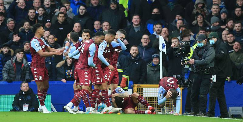 Aston Villa players react after defenders Matty Cash and Lucas Digne were struck by a bottle thrown from the crowd during their win against Everton at Goodison Park in Liverpool on January 22. AFP