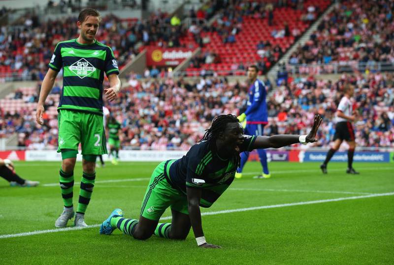 Bafetimbi Gomis celebrates scoring for Swansea City against Sunderland in trademark style by getting on his hands and knees and clawing like a cat. As you do. The routine is apparently a tribute to former Saint-Etienne player Salif Keita, whose nickname was "The Black Panther". Getty
