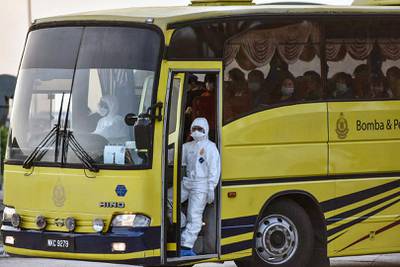 Evacuated Malaysian nationals on a bus after arriving at Kuala Lumpur International Airport, from the Chinese city of Wuhan, in Sepang, Malaysia.  EPA