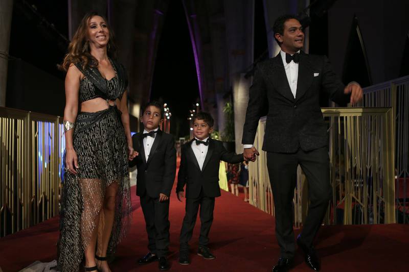 Egyptian actor Asser Yassin, his wife Kenzy Abdallahi and their children walk the red carpet  at the opening ceremony of the  El Gouna Film Festival. AFP