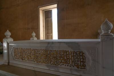 Intricate Islamic calligraphy is inscribed on a tomb above ground in the City of the Dead. Mahmoud Nasr / The National