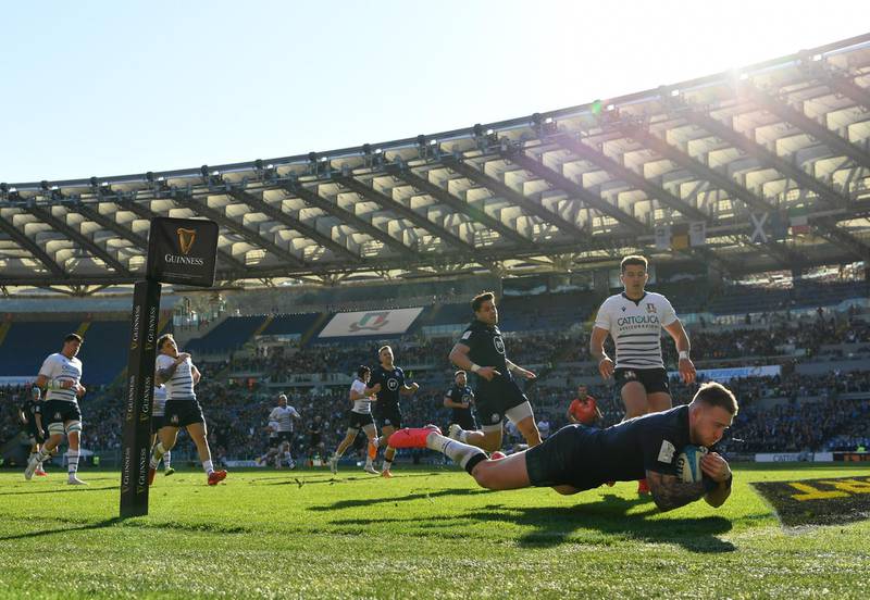 Stuart Hogg of Scotland goes over to score his side's first try against Italy at the Stadio Olimpico in Rome during the Six Nations rugby match on Saturday, February 22. Getty