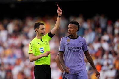 Match referee Ricardo de Burgos Bengoetxea shows a red card to Vinicius Junior of Real Madrid (not pictured) as his teammate Eder Militao looks on. Getty Images