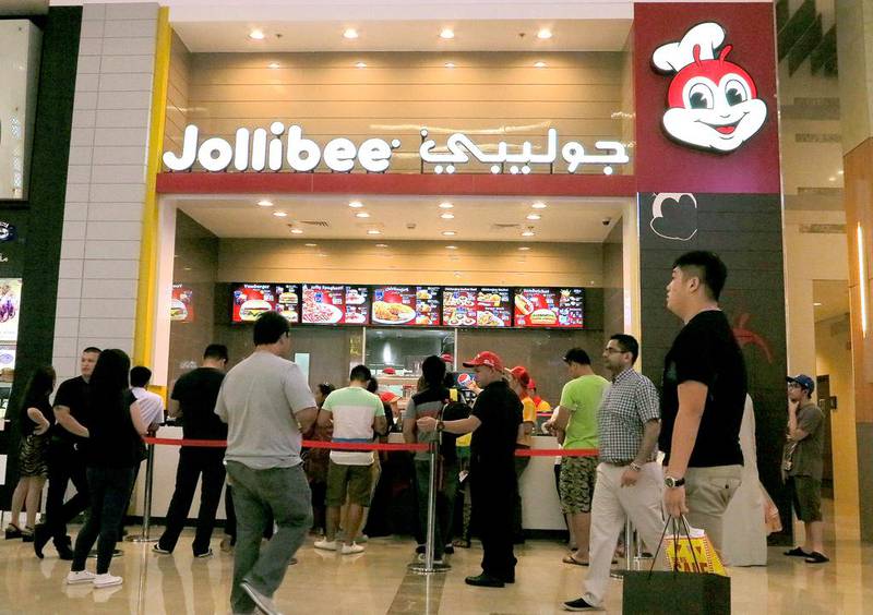 The Jollibee outlet in Dubai Mall has a separate token counter to help customers with ordering. Jeffrey E Biteng / The National 