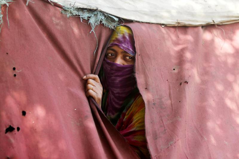 A woman displaced from the Red Sea port city of Hodeidah looks from a tent shelter in Sanaa, Yemen November 28, 2018. Picture taken November 28, 2018. REUTERS/Mohamed al-Sayaghi