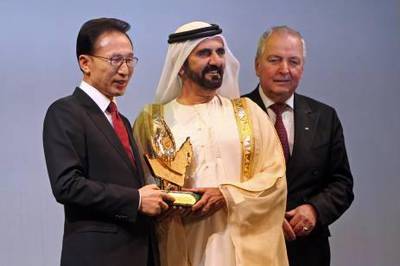 United Arab Emirates - Dubai - March 14, 2011.

NATIONAL: Sheikh Mohammad Bin Rashid Al Maktoum awards the 2011 Zayed International Prize for the Environment to South Korean president Lee Myung-bak as chairman of the international jury Klaus Toepfer, right, watches, at the Dubai Convention Centre on Monday, March 14, 2011. The award is worth $1 million U.S. dollars. Amy Leang/The National