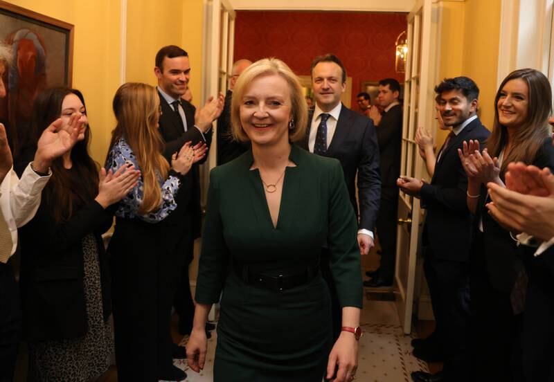 Liz Truss is applauded as she walks out of Number 10 for the last time as prime minister. Photo: No 10 Downing Street