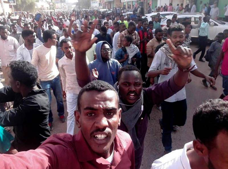 In this Thursday, Dec. 20, 2018 handout photo provided by a Sudanese activist, protesters chant slogans during a demonstration, in Khartoum, Sudan. The protest was one in a series of anti-government protests across Sudan, initially sparked by rising prices and shortages. (Sudanese Activist via AP)