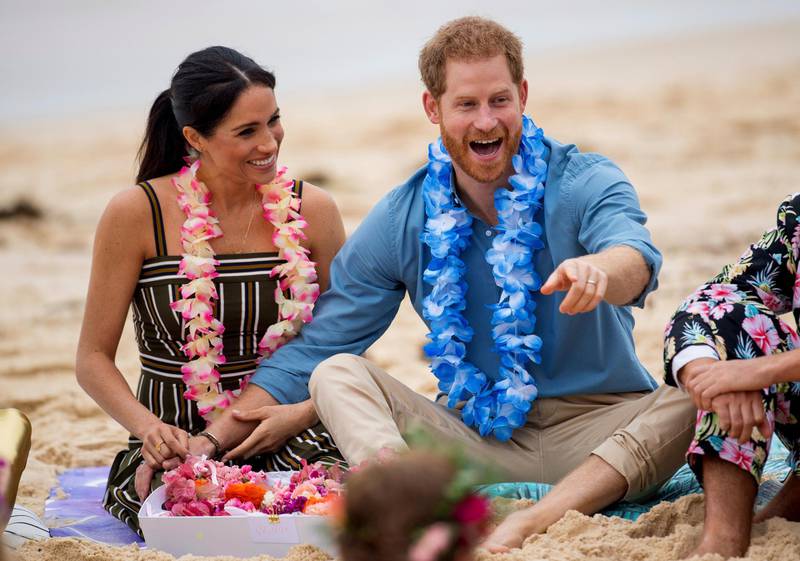 Britain's Prince Harry and Meghan, Duchess of Sussex meet with a local surfing community group, known as OneWave, raising awareness for mental health and wellbeing in a fun and engaging way at Bondi Beach in Sydney, Australia. AP Photo