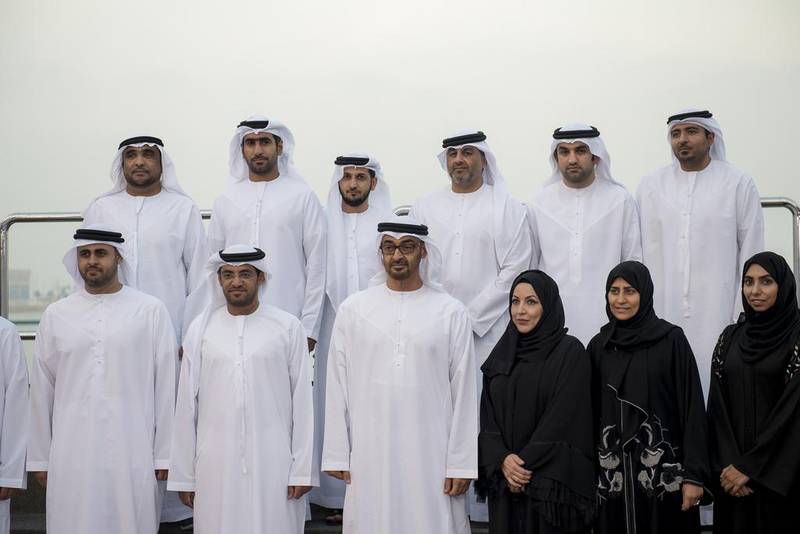 Sheikh Mohammed bin Zayed, Crown Prince of Abu Dhabi and Deputy Supreme Commander of the Armed Forces, stands for a photograph with Abu Dhabi Urban Planning Council employees, during a Sea Palace barza. Seen with Sheikh Diab bin Mohammed bin Zayed (L) and Falah Al Ahbabi, General Manager of the Abu Dhabi Urban Planning Council (UPC) (2nd L). Rashed Al Mansoori / Crown Prince Court — Abu Dhabi