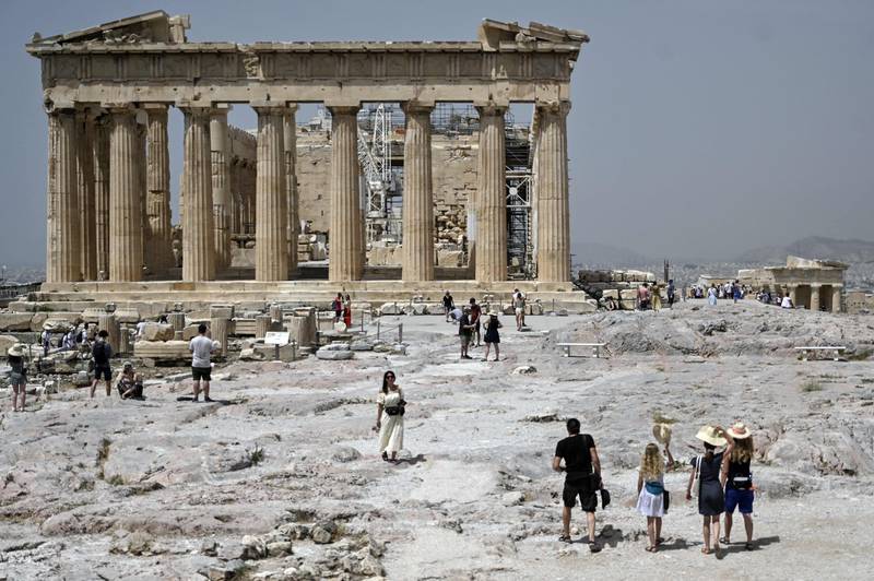 Tourists have started trickling in to the ancient Acropolis archeological site in Athens this month. AFP
