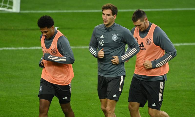 Germany's Serge Gnabry (L), Leon Goretzka and Niklas Suele (R) take part in a training session on the eve of the Uefa Nations League match against Switzerland at the Rheinenergie Stadium. AFP