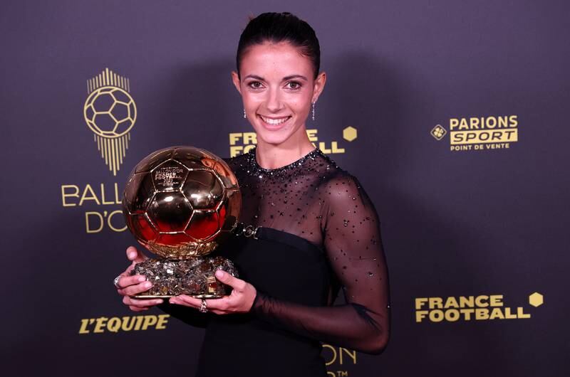Spain and Barcelona player Aitana Bonmati poses with her award after winning the Ballon d'Or Feminin for best female player. EPA