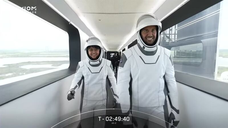 Saudi astronauts Rayyanah Barnawi and Ali Al Qarni on the crew access arm to board the Dragon spacecraft at the Florida Space Centre. Screengrab