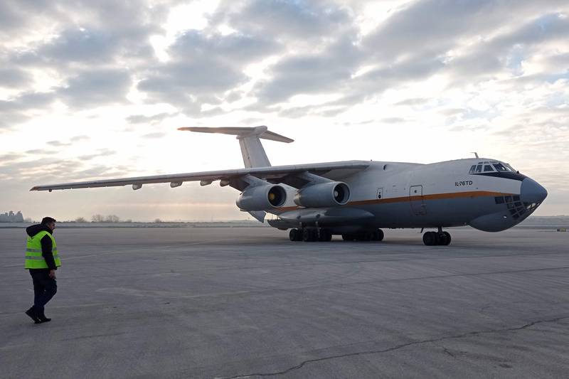 An aircraft carrying humanitarian aid relief packages provided by the UAE for victims of the February 6 earthquake arrives at Aleppo International Airport in February 14. Sana 