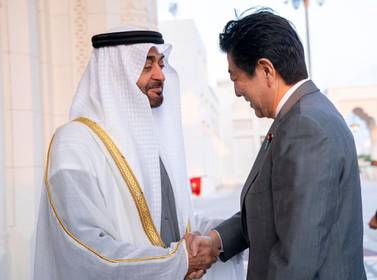 Sheikh Mohamed bin Zayed, Crown Prince of Abu Dhabi and Deputy Supreme Commander of the UAE Armed Forces, welcomes Shinzo Abe, Prime Minister of Japan, to Qasr Al Watan in the country's capital on Monday. Courtesy Sheikh Mohamed bin Zayed Twitter