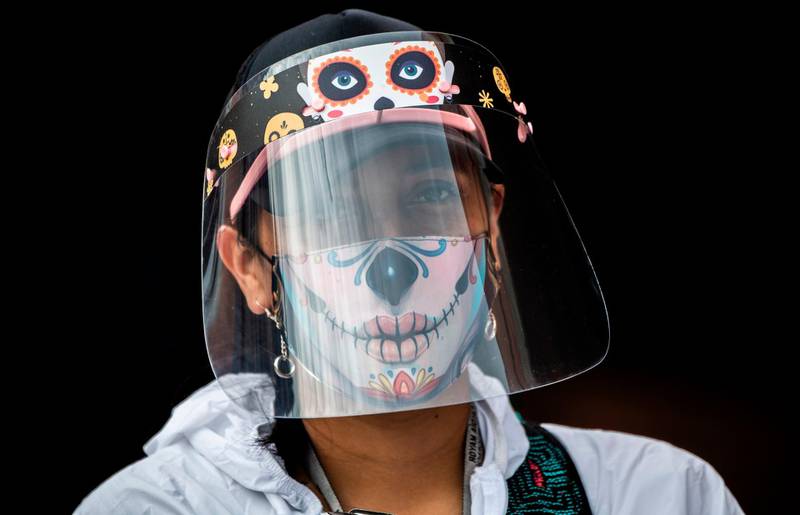 A municipal worker wears a face mask and shield at the Bosa neighborhood, one of the areas with more Covid19 cases in Bogota, Colombia. AFP