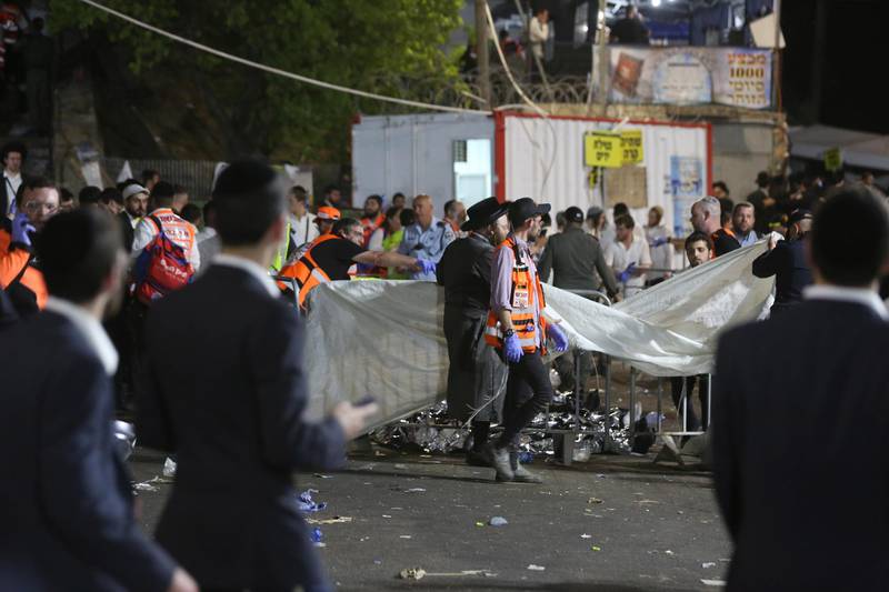 Israeli security officials and rescuers inspect bodies of dozens of ultra-Orthodox Jews who died during Lag BaOmer celebrations at Mount Meron, Israel. EPA
