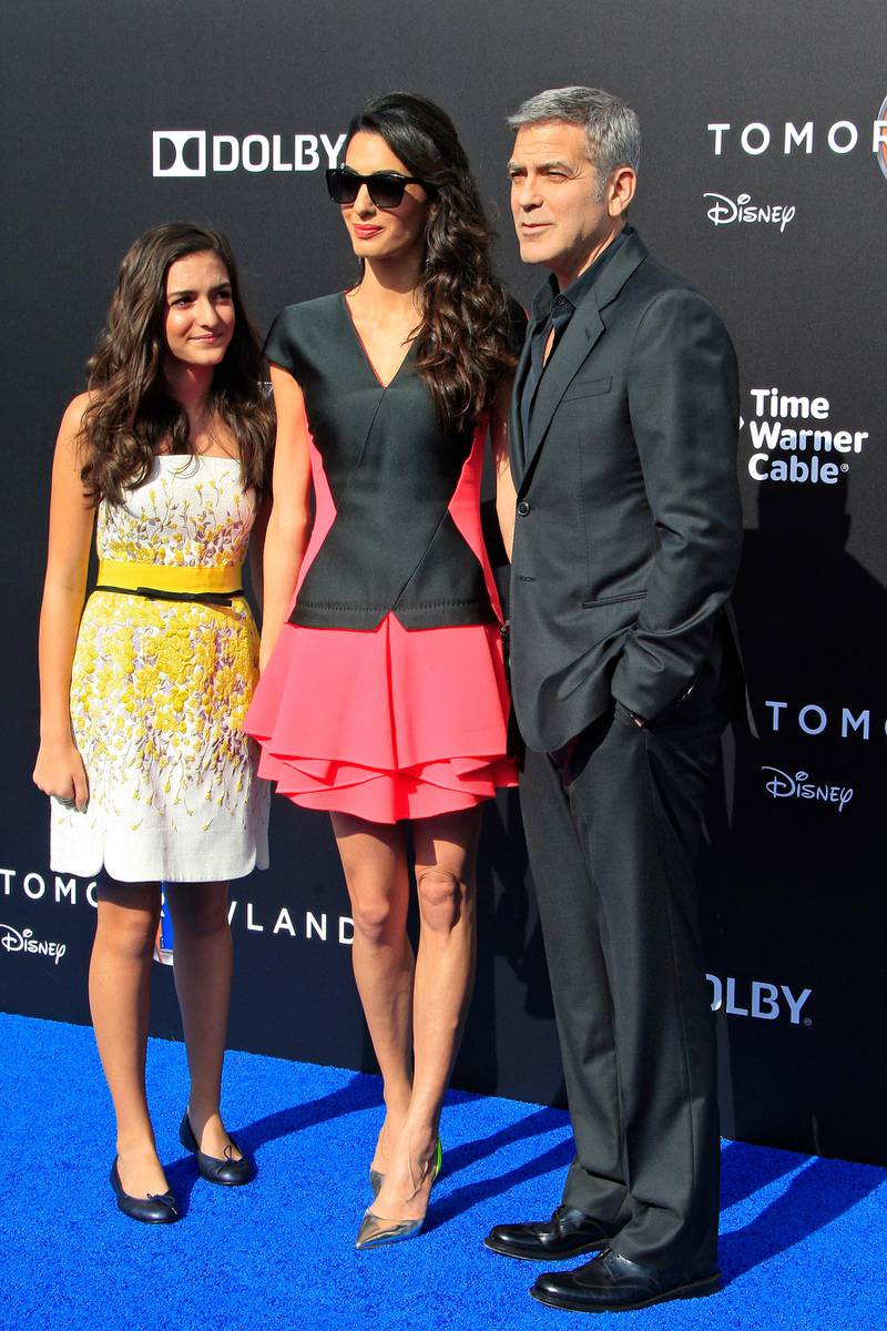 epa04741022 US actor/cast member George Clooney arrives  with his wife Amal Clooney and her niece Mia Alamuddin (R-L) for the world premiere of Disney's 'Tomorrowland' at the AMC Downtown Disney 12 Theater in Anaheim, California, USA, 09 May 2015. The movie opens in the US on 22 May 2015.  EPA/NINA PROMMER