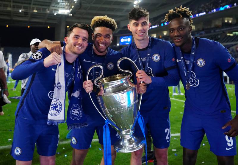 Chelsea's Ben Chilwell, Reece James, Kai Havertz and Tammy Abraham celebrate with the trophy after winning the Champions League in May. Reuters