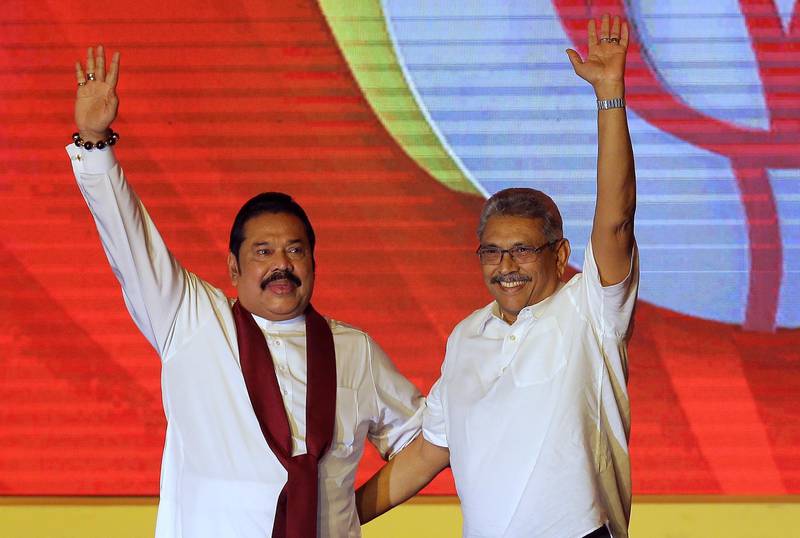 Mahinda Rajapaksa, left, and his brother Gotabaya Rajapaksa at a 2019 party convention in Colombo. AP Photo