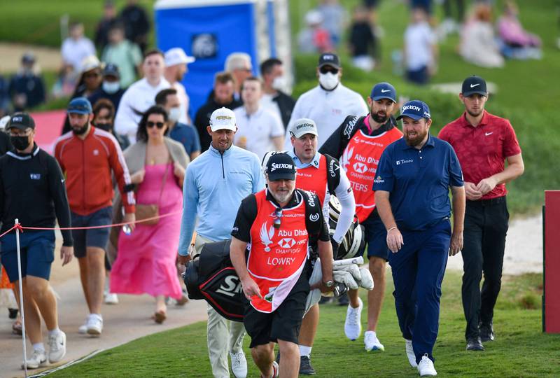 Shane Lowry of Ireland, second right, at the 17th hole during the third round of the Abu Dhabi HSBC Championship. AFP