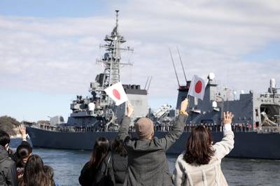 People wave as Japan's Maritime Self-Defence Force destroyer "Takanami" leaves for the Middle East at Yokosuka Naval Base in Yokosuka, Kanagawa prefecture on February 2, 2020. Japan dispatched the naval destroyer to Middle East for a rare overseas mission to ensure safety of Japanese ships amid lingering tension between Iran and the US. - Japan OUT
 / AFP / JIJI PRESS / STR
