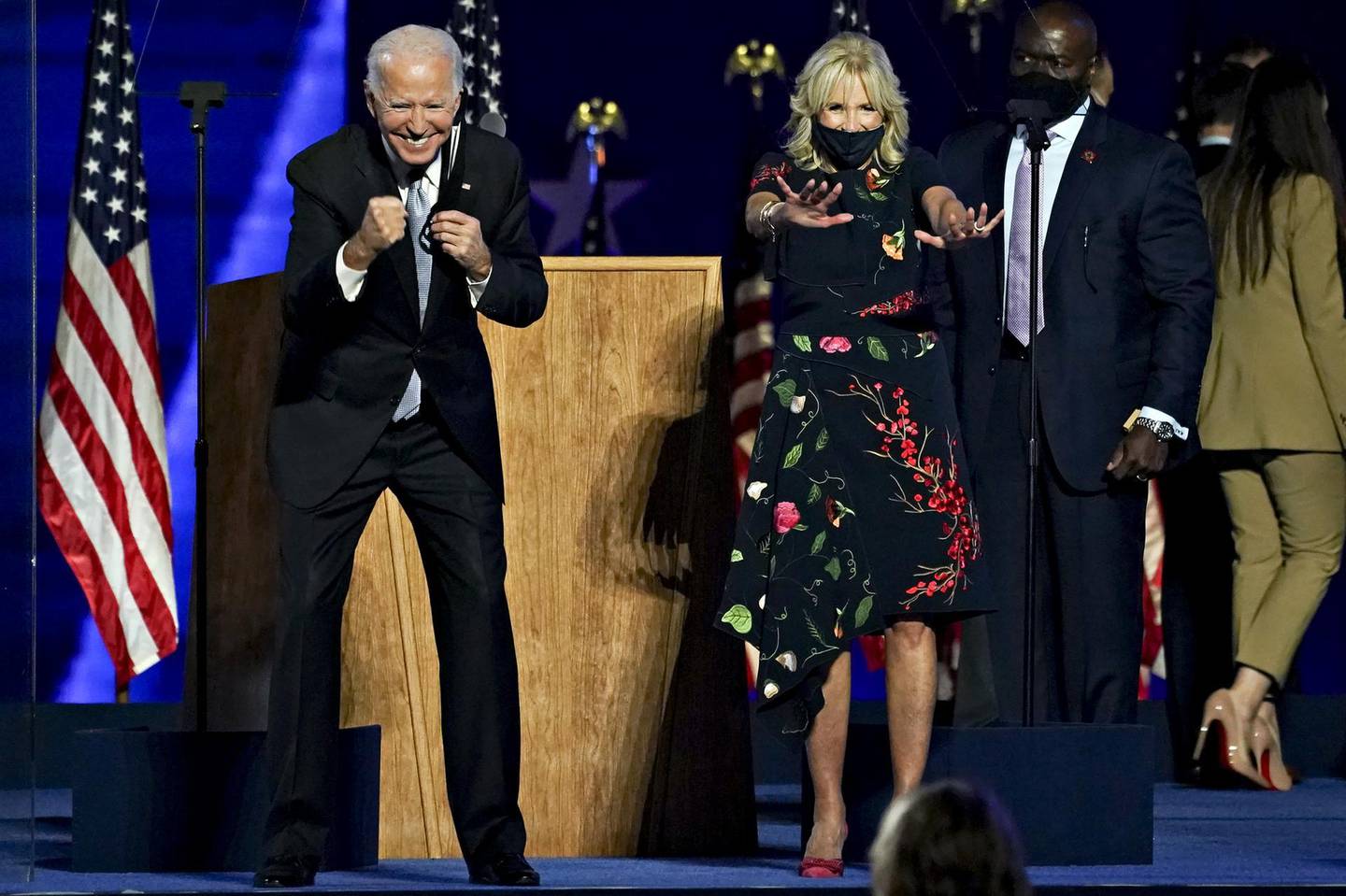 U.S. President-elect Joe Biden, left, and wife Jill Biden gesture to the audience during an election event in Wilmington, Delaware, U.S., on Saturday, Nov. 7, 2020. Biden defeated Donald Trump to become the 46th U.S. president, unseating the incumbent with a pledge to unify and mend a nation reeling from a worsening pandemic, faltering economy and deep political divisions. Photographer: Sarah Silbiger/Bloomberg