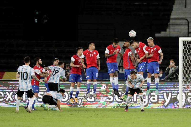 Argentina's Lionel Messi shoots a free kick to score a goal during the Copa America Group B match against Chile. EPA