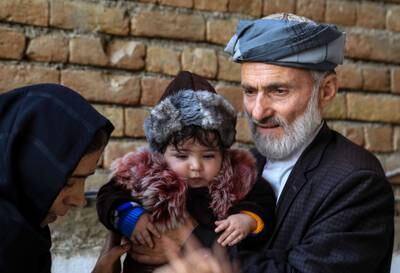 Sohail Ahmadi, an Afghan baby boy who went missing during the disordered evacuation process in Kabul after the takeover by the Taliban in August 2021, is reunited with his grandfather and aunt on January 10, 2022. EPA