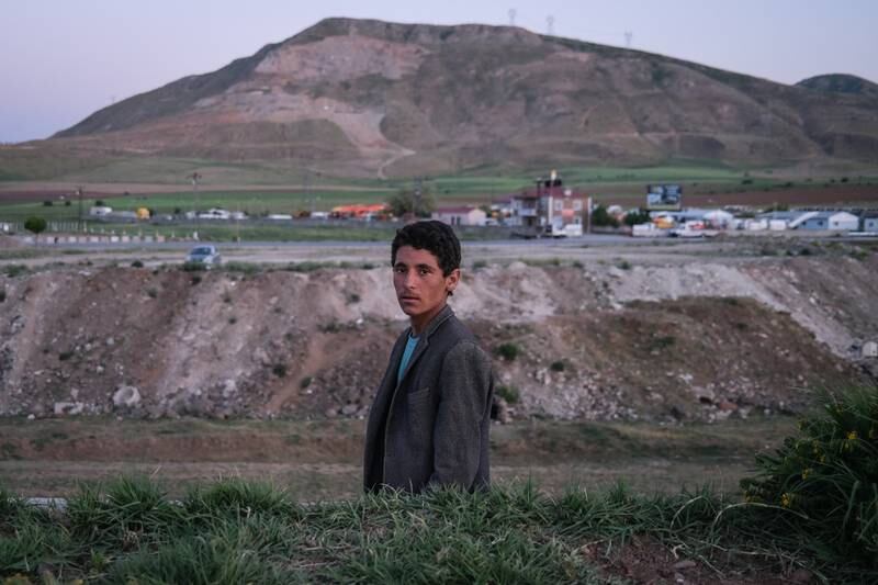 An Afghan refugee boy stands next to the railway in Tatvan district in Bitlis city eastern province of Turkey.