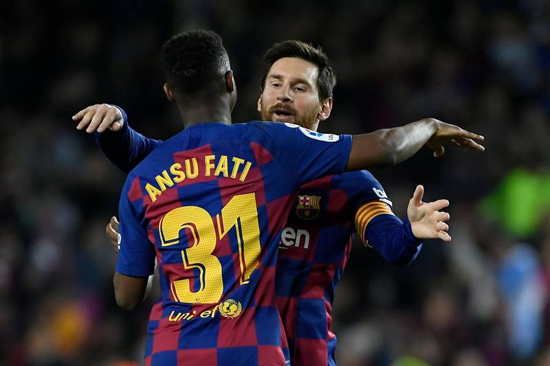 TOPSHOT - Barcelona's Guinea-Bissau forward Ansu Fati (L) celebrates with Barcelona's Argentine forward Lionel Messi after scoring during the Spanish league football match be tween FC Barcelona and Levante UD at the Camp Nou stadium in Barcelona, on February 2, 2020. / AFP / LLUIS GENE
