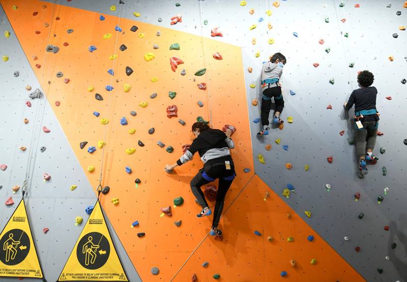 Abu Dhabi, United Arab Emirates - The family scales the indoor climbing walls together at CLYMB, Yas Island. Khushnum Bhandari for The National