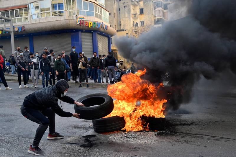 Protesters block a road with burning tyres, during a demonstration against power cuts in Beirut, Lebanon. EPA