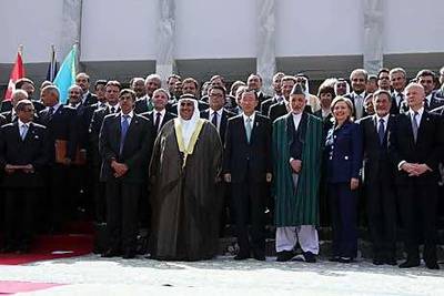 Delegates pose for a photograph with Hamid Karzai, the president of Afghanistan, centre, in Kabul yesterday.