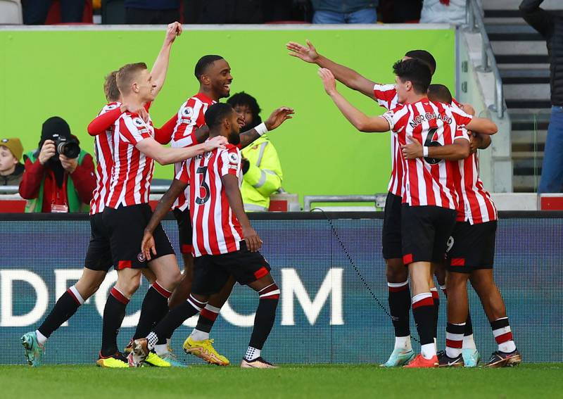 Brentford players celebrate with Ivan Toney after his goal earned a 2-0 lead against Tottenham. Reuters