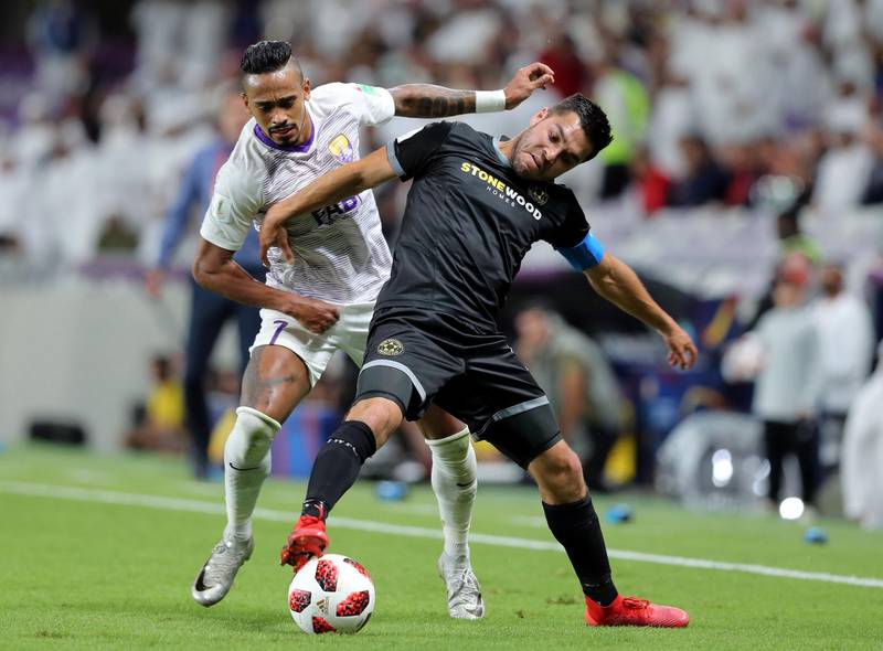 Al Ain, United Arab Emirates - December 12, 2018: Caio of Al Ain and Justin Gulley of Wellington compete during the game between Al Ain and Team Wellington in the Fifa Club World Cup. Wednesday the 12th of December 2018 at the Hazza Bin Zayed Stadium, Al Ain. Chris Whiteoak / The National
