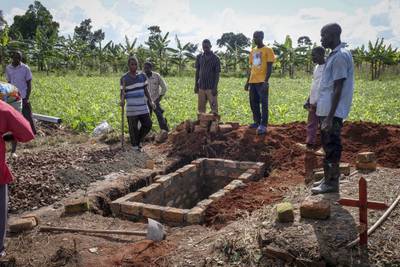 Relatives of a woman who died from Ebola prepare her grave in Kijavuzo village, Mubende district. AP
