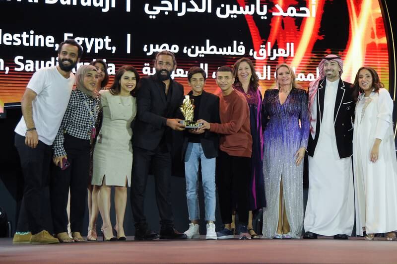 Hussein Mohamad, director Ahmed Yassin Al Daradji, May Odeh, Mohammed Al Turki, Jomana AlRashid  with other guests, celebrate the Best Film win for Hanging Gardens