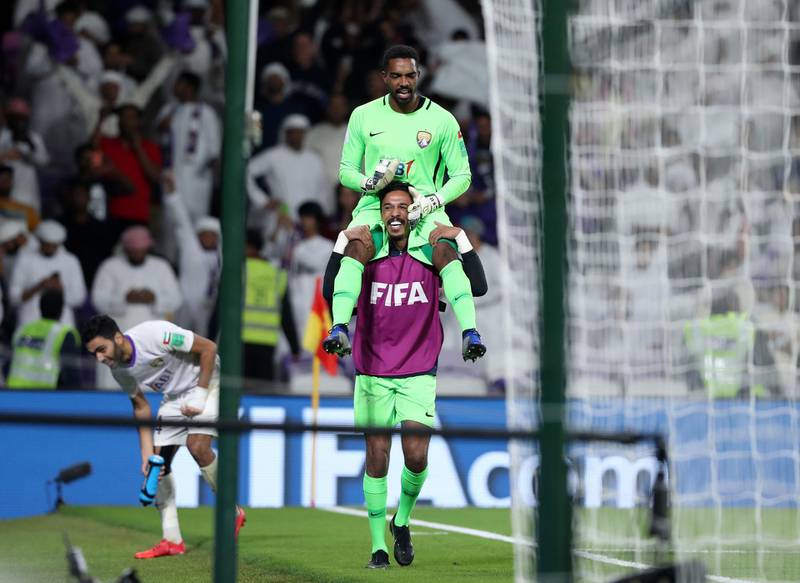Al Ain, United Arab Emirates - December 12, 2018: Al Ain's Khalid Eisa is hoisted up after winning on penalties 4-3 after the game between Al Ain and Team Wellington in the Fifa Club World Cup. Wednesday the 12th of December 2018 at the Hazza Bin Zayed Stadium, Al Ain. Chris Whiteoak / The National