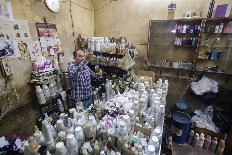 But after Syria plunged into conflict, demand for cheap imitations of premium brands skyrocketed and Al Masri's shop walls are filled with pictures of world-famous perfumes. 