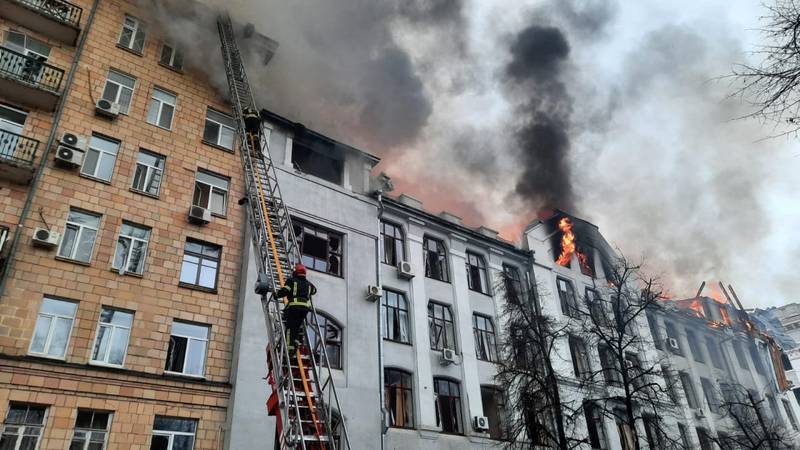 Firefighters battle a blaze in a Kharkiv police building hit by shelling. AFP